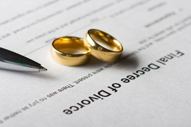 pair of wedding rings on legal document